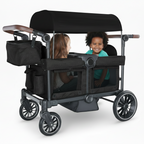 Black stroller with canopy, two children inside on a white background