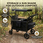 Black outdoor wagon with canopy, snack tray, and storage pouch in a forest setting